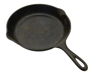 915 - Wagner #0 Cast Iron Fry Pan 12.5"x2" (Description): Wagner #0 cast iron fry pan measuring 12 1/2  inches in diameter by 2 inches deep. This  vintage skillet features the classic Wagner  design with a sturdy curved handle and pour  spouts on either side. The pan shows a well-seasoned, dark patina consistent with  years of use.