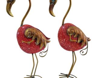 451 - Pr Brass Flamingo Statues w/ Clocks 30"x7" (Description): Pair of decorative brass flamingo statues  featuring red speckled bodies with brass  wings, curved necks, and stylized feet. The  whimsical bird figures display an antique  brass finish on the heads, necks, legs, and wing details. Used as is electric/electronic/mechanical  item. No guarantee all components, untested.