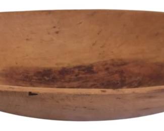 427 - Antique Wooden Dough Bowl 10"x18" (Description): Antique wooden dough bowl with a warm,  honey-toned patina showing age and use. This  oval-shaped hand-hewn bowl features the  characteristic shallow depth and gently  sloping sides typical of traditional dough bowls used for bread making. The natural wood  displays rich variation in color with darker  staining toward the center from years of  use. Measures 10 inches by 18 inches.