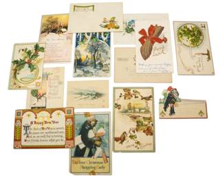 840 - Christmas Postcards Vintage (Description): Assorted vintage Christmas postcards  featuring a variety of holiday designs and  greetings. The collection includes multiple  cards with seasonal imagery and festive  messages typical of early 20th century holiday correspondence.