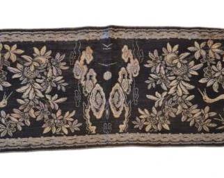 1434 - Asian Table Runner w/ Cranes 57" (Description): The dark navy or black ground is decorated  with metallic thread and silk embroidery  depicting cranes among flowering branches,  auspicious clouds, and foliage in gold,  cream, and blue tones. The panel is bordered with decorative trim and finished with gold  fringe on one side.