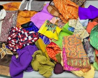 2846 - Lot of Assorted Colorful Scarves (Description): A collection of assorted scarves in a wide  variety of colors, patterns, and styles. The  lot includes scarves in solid colors as well  as geometric, paisley, floral, and polka dot  prints. Colors range from vibrant reds, oranges, purples, and greens to earth tones  including browns and golds. Various fabric  types and sizes are represented in this  diverse grouping.