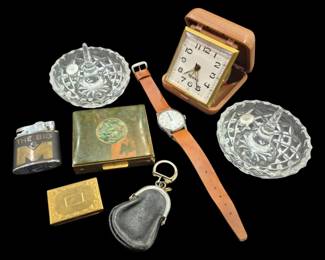 2814 - Assorted Vintage Desk & Personal Accessories (Description): A group of assorted vintage desk and personal  accessories including a Westclox folding  travel alarm clock in tan leather case, two  cut crystal ring dishes, a brass cigarette  case with abalone inlay decoration, a wristwatch with tan leather strap, two  vintage lighters including one marked 'The  Big M', a small gold-tone match safe, and a  small leather coin purse with kiss-lock  closure.