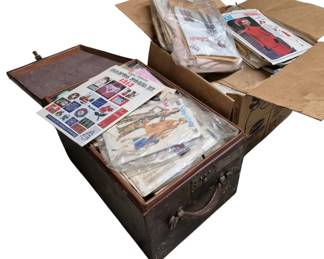 4123 - 2 Boxes Full of Vtg Sewing Patterns (Description): Two boxes full of vintage sewing patterns.  The collection includes patterns from various  manufacturers including McCall's, Vogue, and  Vogue Paris Original, featuring a variety of  clothing designs from different eras. Patterns appear to be from approximately the  1960s through 1980s and include women's  fashion designs. One box is a decorative  wooden chest with hinged lid, while the other  is a cardboard storage box.