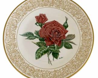 586 - Boehm Porcelain Rose Plate 10.75" (Description): Boehm porcelain plate featuring a beautifully  rendered red rose with green foliage in the  center. The plate is decorated with an ornate  gold scrollwork border and gold rim edge.  Signed by the artist. Measures 10.75 inches in diameter.