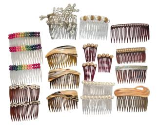 1475 - Collection of Vintage Decorative Hair Combs (Description): A group of vintage decorative hair combs in  various styles and materials. The collection  includes combs adorned with faux pearls,  rhinestones, colorful beads, and floral  embellishments. Materials include tortoiseshell-style plastic, clear plastic,  and horn-like synthetic materials. Styles  range from simple everyday combs to more  ornate pieces suitable for special occasions.  One comb features an engraved silver-tone
