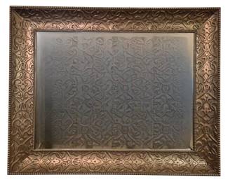 3772 - Ornate Carved Wood Frame Mirror 39"x50" (Description): Large decorative mirror featuring an ornate  wood frame with intricate carved scrollwork  and floral motifs throughout. The frame  displays a bronze or copper-toned finish with  beaded inner border detail.