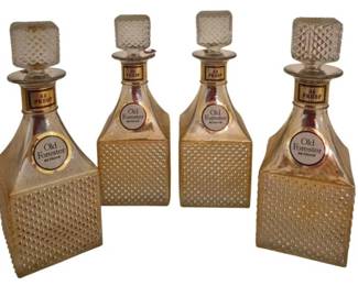 3965 - 4 Vtg Old Forester Diamond Point Decanters (Description): Set of four vintage Old Forester bourbon  whiskey decanters featuring an attractive  diamond point hobnail pattern. Each glass  decanter displays the Old Forester label and  86 Proof marking, with matching textured stoppers. The bottles showcase the  distinctive square-shaped design  characteristic of mid-century promotional  decanters.