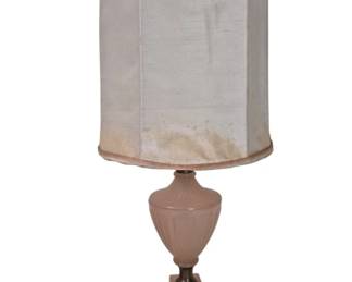 1291 - Vtg Pink Glass Urn Form Table Lamp 20" (Description): Vintage pink glass table lamp featuring an  elegant urn-shaped body with decorative  molded details. The lamp sits on a stepped  square base in matching pink glass with brass  or bronze-tone metal fittings. Includes a fabric drum shade with trim. Measures 20  inches tall. Used as is electric/electronic/mechanical  item. No guarantee all components, untested.