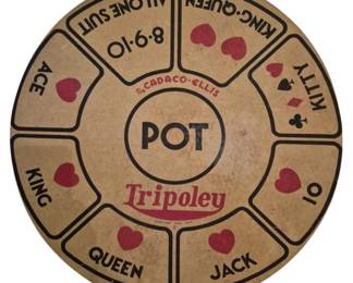 4013 - Vtg Cadaco-Ellis Tripoley Game Board (Description): Vintage Cadaco-Ellis Tripoley game board  featuring a circular design with a central  pot area surrounded by card-themed betting  sections. The board displays playing card  values including Ace, King, Queen, Jack, 10, 8-9-10, King-Queen, and All One Suit, along  with Kitty. Red and black suit symbols  decorate the various sections. The board  shows charming age-related patina consistent  with mid-century game pieces.