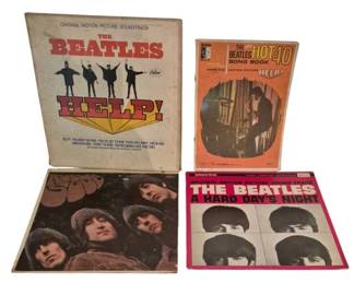 3909 - Beatles Vinyl Record Collection w/ Song Book (Description): A collection of Beatles records including the  original motion picture soundtrack albums  for Help! and A Hard Day's Night on Capitol  Records, along with Rubber Soul. The lot also  includes The Beatles Hot 40 Song Book from the motion picture Help! The records and book  show signs of age and use consistent with  vintage items.