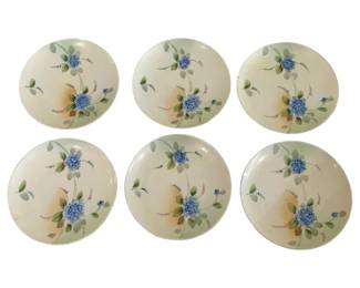 422 - 6 Nippon Plates 6.5" (Description): Set of six Nippon plates featuring  hand-painted blue floral designs with green  foliage on a cream background. Each plate  measures 6.5 inches in diameter.