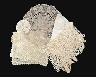 350 - Lot of Doilies, Placemats & More (Description): A lot of doilies, placemats, and more. This  collection includes various handcrafted lace  pieces in cream and white tones, featuring  different crochet patterns and textile  techniques.