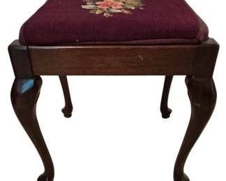 3743 - Vtg Needlepoint Floral Stool Queen Anne Legs (Description): Vintage stool featuring a burgundy  needlepoint embroidered seat with a floral  rose motif. The dark wood frame is supported  by graceful Queen Anne style cabriole legs  with pad feet. Measures 20" x 15" x 14".