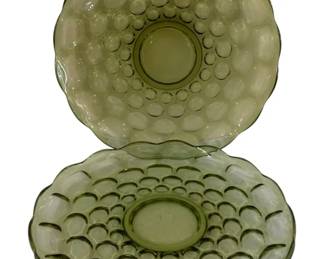 593 - 2 Mid-Century Green 13in Platters (Description): Platters have scalloped edges and circular  bubble motifs arranged in concentric rings  around a smooth center. Each plate measures  13 inches in diameter.