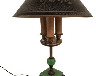 3784 - Agate Base Lamp w/ Towle Lamp Shade 21" (Description): A distinctive table lamp featuring a green  agate or jadeite glass base and matching ball  accent, supported by a decorative brass  footed stand. The lamp includes a Towle  tole-style metal shade in dark finish with hand-painted floral decoration and pierced  gallery top. The body features three  candle-style light sockets in a bouillotte  arrangement. Used as is electric/electronic/mechanical