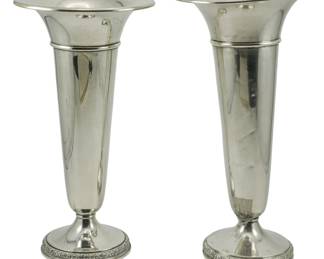 81 - Pair Prelude International Sterling Vases (Description): Pair of Prelude International sterling  weighted vases featuring flared rims and  decorative banded bases. Each vase measures  9.5 inches in height. 26oz total weight.