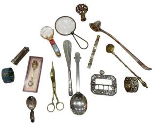 1207 - Vtg Antique Desk & Vanity Items Collection (Description): A charming collection of vintage and antique  items including a cloisonne enamel napkin  ring, decorative thimble holder, ornate shoe  horn, brass scissors, magnifying glasses with  decorative handles, silver-plated serving spoon, cut steel buckle, mother of pearl  handled accessories, shell-form candle  snuffer, pierced napkin ring, and various  decorative finials and small collectibles. An  eclectic assortment of desk and vanity