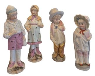1467 - 4 Vintage Bisque Figurines 9" (Description): Each figure is rendered in bisque porcelain  with hand-painted details in soft pastel  colors including pink, blue, and yellow. The  children are shown in various poses,  including a boy in pink shorts, a girl with an accordion, and two others in charming  period attire with hats and bonnets.