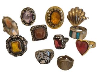 1493 - Vintage Rings, Stone Set, Silver & Gold Tone (Description): Attractive mixed lot of vintage rings  featuring a range of styles, stones, and  settings. This group includes several  eye-catching pieces with large faceted stones  and cabochons in amber, red, and purple tones, along with more detailed designs  showcasing filigree and bezel work. Also  included is a signet-style ring with a  figural motif, adding a bit of character to  the assortment. Metals appear to be a mix of
