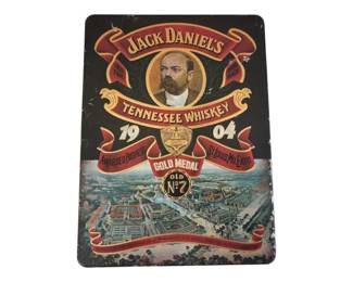 559 - Jack Daniel's 1904 Gold Medal No.7 Boxed Gift Set (Description): Jack Daniels tin gift box set featuring  classic Tennessee Whiskey branding and  memorabilia. The decorative tin displays the  iconic Old No. 7 logo along with imagery  commemorating the 1904 St. Louis World Expo Gold Medal award. The design includes a  portrait medallion and vintage-style graphics  depicting the exposition grounds. This  collectible tin contains cards and additional  items. Bottle contents not included.