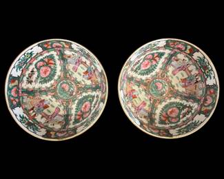 540 - Pr Rose Medallion Porcelain Bowls 10"x5" (Description): A pair of Rose Medallion porcelain bowls  measuring 10 inches in diameter by 5 inches  deep. Each bowl features the classic Rose  Medallion pattern with alternating panels  depicting figural scenes of Chinese court life and floral motifs with pink peonies and  green foliage. The central medallion  showcases birds amid flowering branches. The  interior and exterior are decorated in the  traditional famille rose palette with gilt