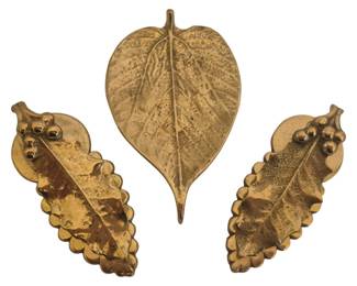 2778 - 3 Pc Virginia Metacrafters Items (Description): Collection includes one heart-shaped tobacco  leaf small tray with detailed vein texturing  and two matching holly leaf brass clips with  berry accents. Each piece features a warm  golden brass finish with naturalistic leaf detailing.