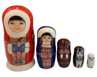 640 - 6" Russian Eskimo 5pc Nesting Doll Set (Description): Authentic Eskimo 5-piece Russian nesting  matryoshka doll set, featuring hand-painted  details including a family member with a  fish, a walrus, a husky, and a snowy owl.  Largest 6" tall