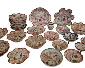 4000 - Group of Satsuma Bowls & Dishes 26pc (Description): A collection of twenty-six pieces of Japanese  Satsuma ware featuring hand-painted figural  and floral scenes. The group includes various  bowls, dishes, and serving pieces with  scalloped and ruffled edges, predominantly decorated with geisha figures in garden  landscapes. Most pieces feature  characteristic red-orange borders with  polychrome enameled decoration on cream  grounds. The collection includes stacked