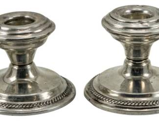 710 - Newburyport Silver Co. Sterling Candlestands (Description): Four Newburyport Silver Co. sterling silver  candlestands featuring classic stepped design  with decorative rope-edge bases. Each  measures 2.5" in height.