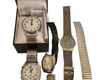 1489 - Collection of Seven Wristwatches (Description): A collection of seven vintage & etc  wristwatches featuring various styles and  brands. The assortment includes one watch in  its original presentation box with paperwork,  along with six loose watches. The collection showcases different band styles including  expansion bands, mesh bands, and leather  straps. Dials feature both Arabic numeral and  Roman numeral configurations in silver and  white tones. Various case styles are