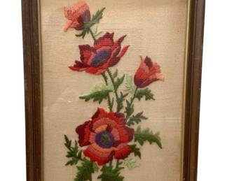 1182 - Needlepoint Flowers in Frame 17.5"x12" (Description): Framed needlepoint artwork featuring a floral  design. The piece measures 17 1/2 inches by  12 inches and is presented in a wooden frame.