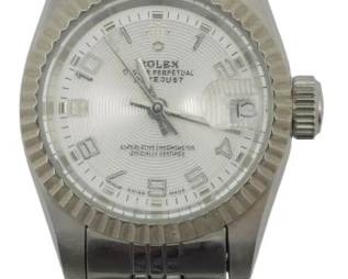 8007 - Rolex Lady-Date just Ref 69173 No Movement (Description): Rolex Lady-Date just Reference 69173 in  stainless steel and white gold. This  timepiece features a fluted bezel,  silver-tone concentric dial with Arabic  numeral hour markers, and a Jubilee-style bracelet. Please note this watch has no  movement. Used as is electric/electronic/mechanical  item. No guarantee all components, untested.