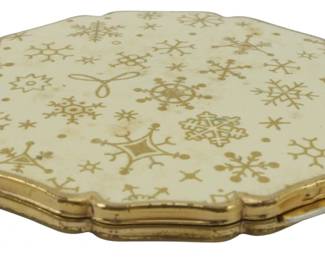 1748 - England Maker Snowflake Compact 3" (Description): A decorative compact made in England  featuring a snowflake design. The piece  measures 3 inches in diameter.