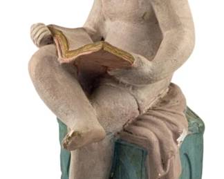 760 - Ca. 1900 Child Reading Plaster Figure 14" (Description): A charming plaster figure dating to circa  1900, depicting a seated child engrossed in  reading a book. The piece features polychrome  painted decoration and measures 14 inches in  height.