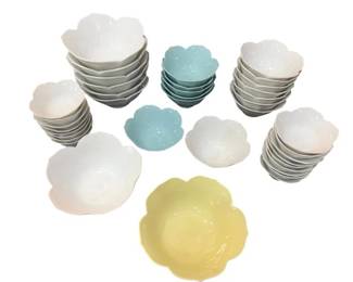 1222 - Assorted Flower-Shaped Ceramic Bowls (Description): Assorted flower-shaped ceramic bowls in  various sizes and colors including white,  yellow, light blue, and teal. The collection  features scalloped petal-edge designs with  some pieces displaying a speckled glaze finish. Includes a mix of larger serving  bowls and smaller individual bowls.