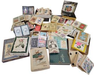456 - Assorted Vintage Playing Cards Collection (Description): A large assortment of vintage playing cards  featuring a variety of designs and styles.  The collection includes numerous decks with  decorative backs depicting florals, birds,  landscapes, and figural illustrations. Notable brands visible include Hoyle,  Hallmark, and Congress, with several bridge  ensemble sets included. The cards span  various eras and range from standard playing  decks to specialty bridge cards, many in