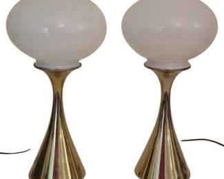 3811 - Pair Mid-Century Laurel Mushroom Lamps 16" (Description): Pair of Laurel mushroom lamps measuring 16  inches tall. These mid-century modern table  lamps feature polished brass hourglass-shaped  bases with elegant tapered silhouettes and  white opaline glass mushroom globe shades. Both lamps are in working condition with  original cords. Used as is electric/electronic/mechanical  item. No guarantee all components, untested.