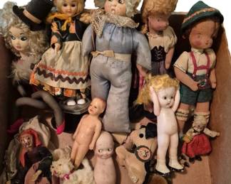 3729 - Collection of Vtg Dolls & Miniature Figures (Description): A charming collection of vintage dolls and  accessories featuring an assortment of  composition, bisque, celluloid, and cloth  dolls in various sizes and styles. The  grouping includes a Kewpie-style doll, character dolls in traditional folk costumes,  a cloth doll with painted features wearing a  blue outfit, small bisque frozen  Charlotte-type figures, and miniature teddy  bears. Several dolls retain their original
