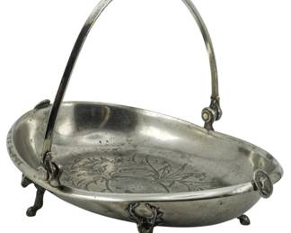 91 - Simpson Hall Miller & Co Silver Plate Basket (Description): Simpson Hall Miller & Co silver plate basket  featuring an oval form with swing handle and  decorative feet. Measures 9 inches by 8  inches by 10 inches.