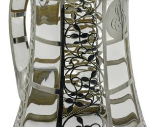 82 - Unknown Maker Silver Overlay Glass Pitcher 9" (Description): Unknown Maker silver overlay glass pitcher  featuring decorative overlay work on clear  glass. Measures 9 inches in height.