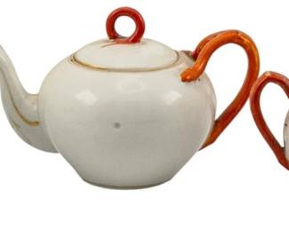 737 - 3pc H.J. Porcelain Tea Set, as is (Description): A three-piece H.J. porcelain teaset  comprising a teapot, creamer, and sugar bowl  (cracked).
