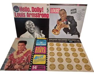 3911 - Elvis Presley & Louis Armstrong Albums (Description): A collection of four vinyl record albums  featuring Elvis Presley and Louis Armstrong.  The Louis Armstrong albums include "Hello,  Dolly!" on Kapp Records and "Mame" on Mercury  Records. The Elvis Presley albums include the original soundtrack album "Blue Hawaii"  on RCA featuring 14 great songs, and  "Worldwide Gold Award Hits, Parts 1 & 2" on  RCA. All records are in their original album  sleeves.