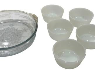 937 - Fire King Blue & Milk Glass Bowls (Description): Collection of Fire King glassware featuring  six white milk glass custard cups and one  blue glass baking dish with decorative  embossed pattern and tab handles. The baking  dish measures 8.5 inches in diameter.