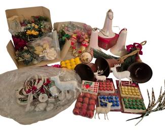 4180 - Group of Vintage Christmas Ornaments (Description): A large assortment of vintage Christmas  ornaments and decorations. The collection  includes white plastic reindeer figures,  glass ball ornaments in various colors  including boxed sets of red, blue, green, and gold ornaments by Best Brite and Moon Brite,  decorative bells, elf figurines, floral  picks, an angel ornament, a pink plaid  sleigh, frosted glass bell ornaments, beaded  garlands, and assorted holiday greenery and