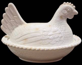 4035 - Milk Glass Hen on Nest Covered Dish 5"x7.5" (Description): Milk glass hen on nest covered dish featuring  a detailed hen-shaped lid with textured  feather design, sitting atop a basket-weave  patterned base with a beaded rim edge.