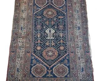 535 - Antique Turkish Rug 59"x40.5" (Description): Antique Turkish rug featuring a traditional  geometric design with a deep blue central  field. The rug displays a central medallion  surrounded by four corner medallions in muted  rose and cream tones. Multiple decorative borders frame the piece with intricate tribal  motifs. The color palette includes navy  blue, rust, cream, and soft burgundy. Shows  age-appropriate wear consistent with its  antique status. Measures 59 inches by 40.5