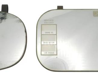 1736 - 2 Vintage Ford Auto Visor Mirrors (Description): Two vintage car mirrors, one of which is  marked Ford. The Ford-marked mirror features  service and travel record sections with  labeled fields for tracking maintenance and  trips.