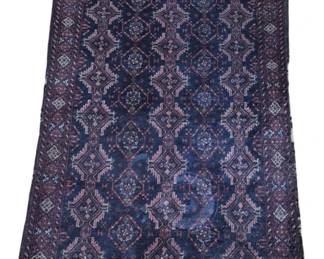 2797 - Vintage Hand-Knotted Baluch Wool Rug 63"x34" (Description): Vintage hand-knotted Baluch wool rug  featuring an allover geometric pattern with  repeating diamond medallions and floral  motifs. The rug displays a deep navy blue  field with rose, pink, and cream accents throughout the traditional tribal design.  Multiple decorative borders frame the central  field. Measures 63 inches by 34 inches.