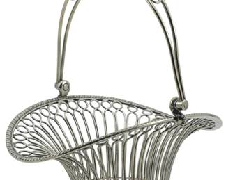 86 - Vintage Silver Plate Basket 9"x7"x8.5" (Description): Vintage silver plate basket featuring an  elegant wire construction with looped  decorative elements and a graceful arched  handle. The basket has a flared, asymmetrical  form with a solid base. Measures 9 inches by 7 inches by 8.5 inches.